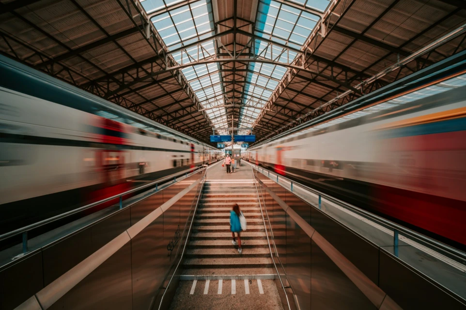 white and red train in tunnel